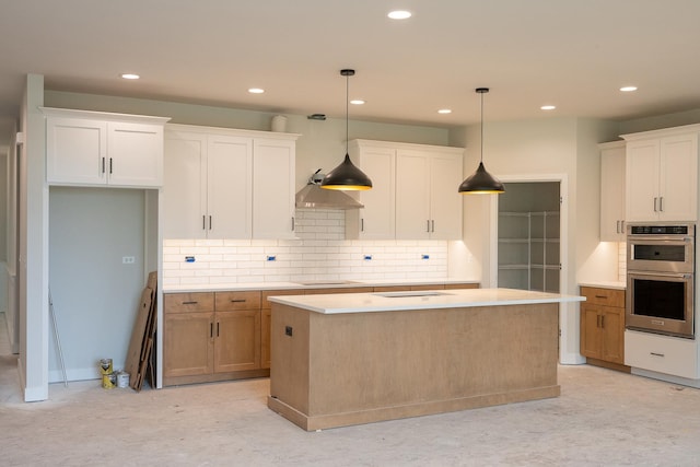 1568 Dempsey Dr, Saint Charles, IL 60174 - kitchen with double oven, backsplash, recessed lighting, light countertops, and a kitchen island