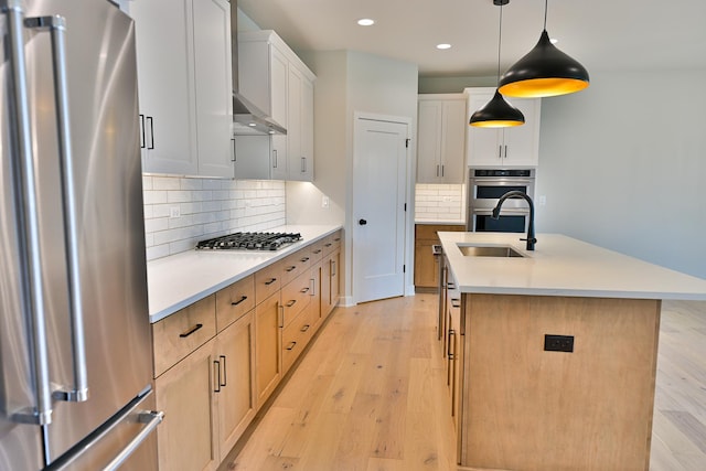 1568 Dempsey Dr, Saint Charles, IL 60174 - kitchen with stainless steel appliances, light wood-style flooring, recessed lighting, backsplash, and a kitchen island with sink