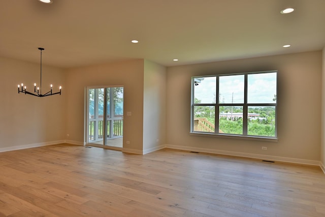 1568 Dempsey Dr, Saint Charles, IL 60174 - unfurnished room with a chandelier, light wood finished floors, and recessed lighting