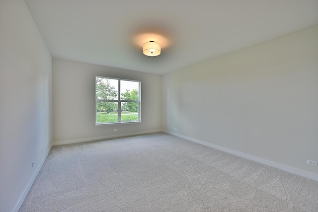 1568 Dempsey Dr, Saint Charles, IL 60174 - spare room featuring light colored carpet and baseboards