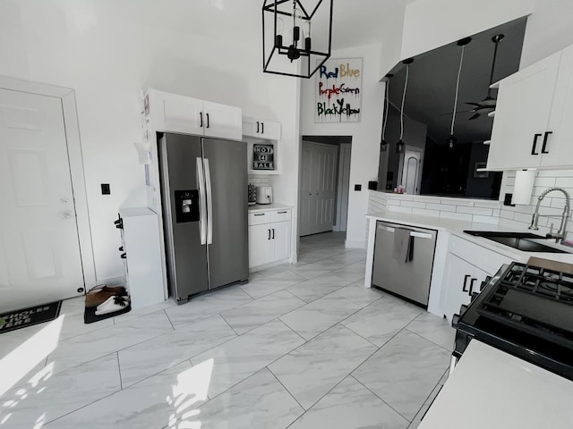 9420 S 77th Ct Unit 3E, Hickory Hills, IL 60457 - kitchen with appliances with stainless steel finishes, a towering ceiling, a sink, light marble finish flooring, and white cabinetry