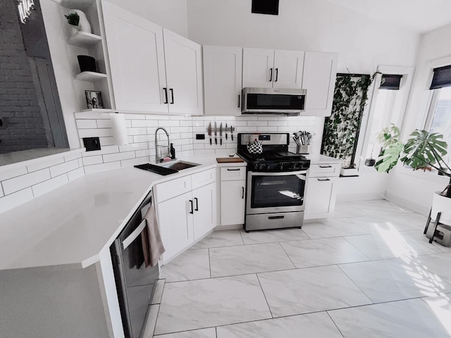 9420 S 77th Ct Unit 3E, Hickory Hills, IL 60457 - kitchen featuring open shelves, stainless steel appliances, a sink, white cabinets, and tasteful backsplash