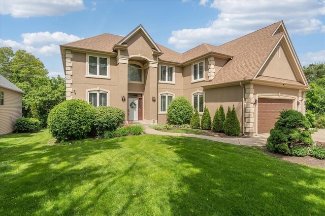 670 Leslie Ct, Carol Stream, IL 60188 - view of front of property with stucco siding, roof with shingles, a front yard, and a garage
