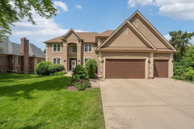 670 Leslie Ct, Carol Stream, IL 60188 - view of front of home featuring driveway, a garage, a front lawn, and stucco siding