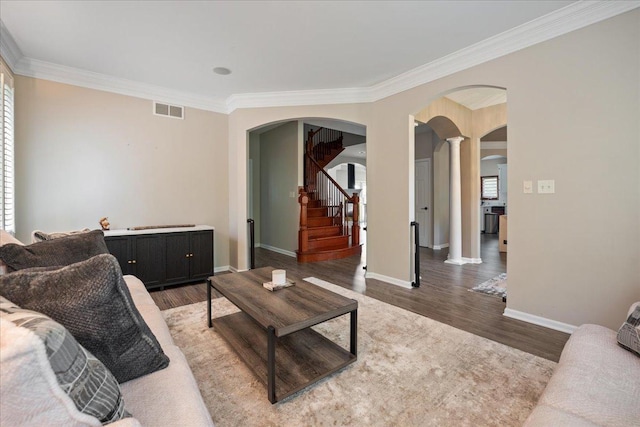 670 Leslie Ct, Carol Stream, IL 60188 - living room with arched walkways, ornamental molding, ornate columns, wood finished floors, and stairway