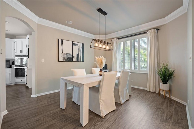670 Leslie Ct, Carol Stream, IL 60188 - dining area featuring ornamental molding, arched walkways, baseboards, dark wood-type flooring, and a chandelier