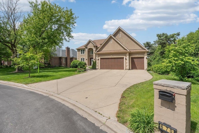 670 Leslie Ct, Carol Stream, IL 60188 - view of front of property with a front lawn, driveway, a garage, and stucco siding