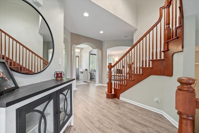 670 Leslie Ct, Carol Stream, IL 60188 - entryway featuring arched walkways, stairs, light wood-type flooring, recessed lighting, and baseboards