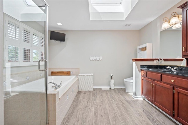 670 Leslie Ct, Carol Stream, IL 60188 - full bath with toilet, vanity, a bath, a stall shower, and wood finished floors