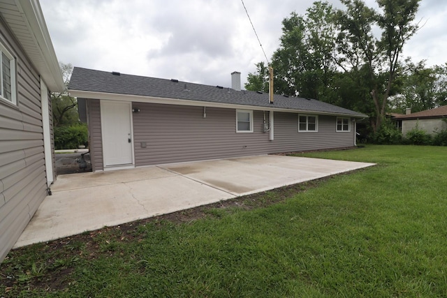 18310 Anthony Ave, Country Club Hills, IL 60478 - back of property featuring a lawn, a patio area, and a chimney