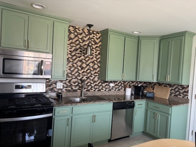 3641 W 120th Pl, Alsip, IL 60803 - kitchen with appliances with stainless steel finishes, green cabinetry, a sink, and decorative backsplash