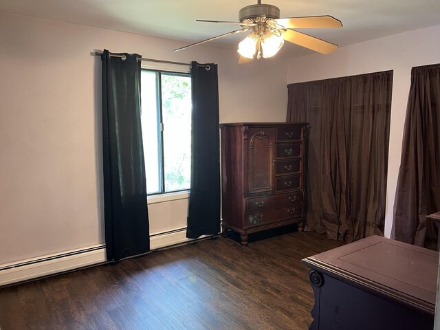 10940 S Worth Ave Unit 9, Worth, IL 60482 - bedroom featuring dark wood-style flooring, a baseboard radiator, and ceiling fan