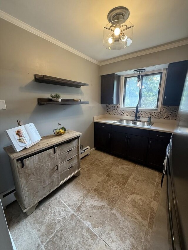 10940 S Worth Ave Unit 9, Worth, IL 60482 - kitchen featuring a sink, ornamental molding, dark cabinets, decorative backsplash, and light countertops