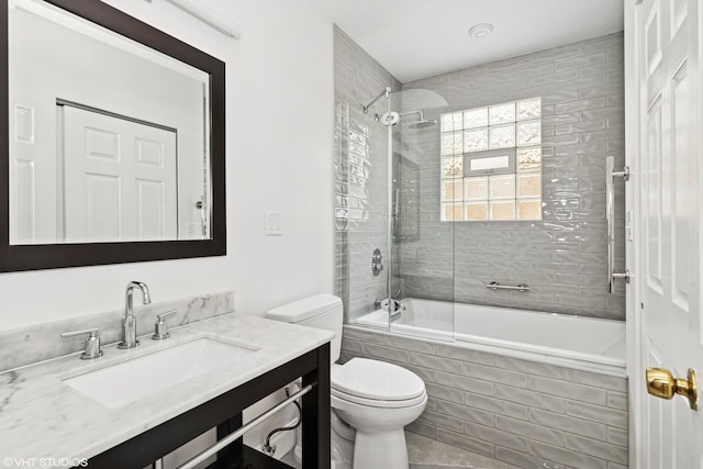 2637 W Huron St, Chicago, IL 60612 - bathroom featuring tiled shower / bath combo, vanity, and toilet