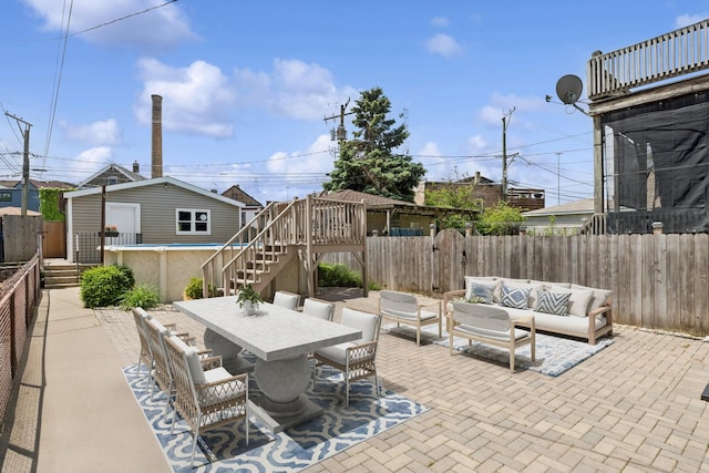 2637 W Huron St, Chicago, IL 60612 - fenced backyard with an outdoor living space, stairs, a patio, outdoor dining space, and an outdoor structure