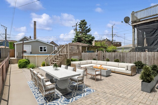 2637 W Huron St, Chicago, IL 60612 - fenced backyard featuring an outdoor hangout area, stairs, a patio, an outdoor structure, and outdoor dining area