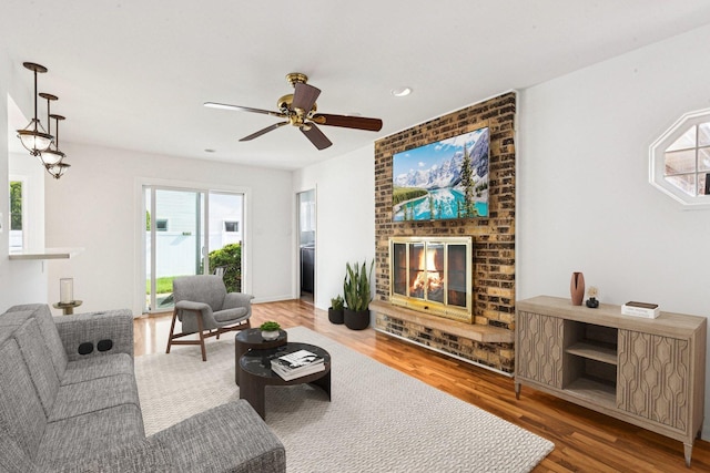 1946 Briarcliffe Blvd, Wheaton, IL 60189 - living room featuring healthy amount of natural light, a fireplace, wood finished floors, and recessed lighting