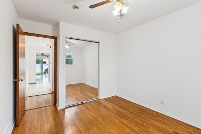 1946 Briarcliffe Blvd, Wheaton, IL 60189 - unfurnished bedroom with light wood-style flooring, a closet, and a ceiling fan