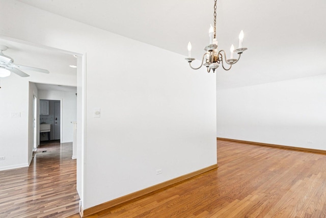 1946 Briarcliffe Blvd, Wheaton, IL 60189 - unfurnished room with wood finished floors, a chandelier, and ceiling fan