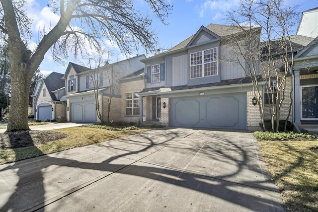514 Cherbourg Dr, Buffalo Grove, IL 60089 - traditional-style house featuring brick siding, driveway, and a garage