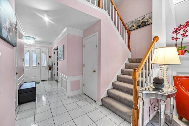 514 Cherbourg Dr, Buffalo Grove, IL 60089 - tiled foyer entrance featuring stairway, wainscoting, ornamental molding, and a decorative wall
