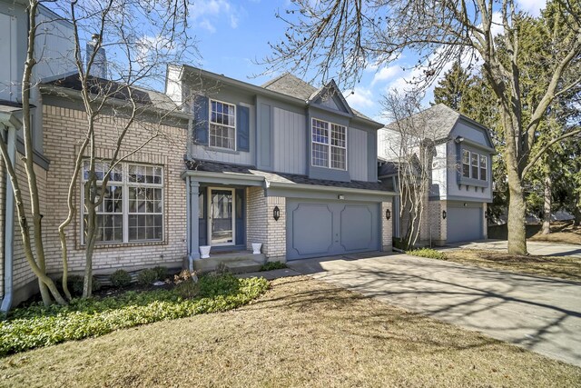 514 Cherbourg Dr, Buffalo Grove, IL 60089 - traditional home featuring brick siding, concrete driveway, a garage, and a shingled roof