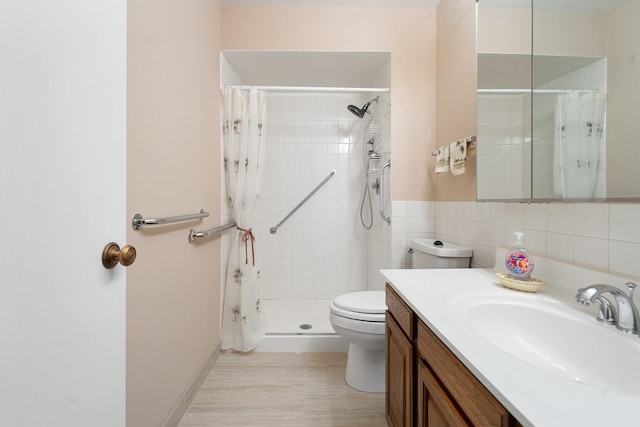 1175 Lake Cook Rd Unit 201W, Northbrook, IL 60062 - full bathroom featuring toilet, vanity, tile walls, tiled shower, and wood finished floors