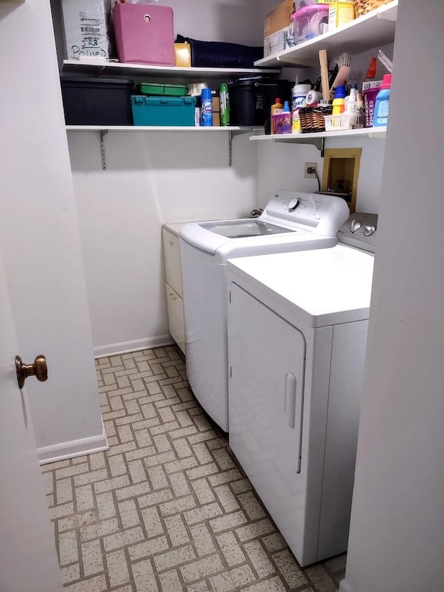 1175 Lake Cook Rd Unit 201W, Northbrook, IL 60062 - washroom featuring independent washer and dryer, brick patterned floors, and baseboards