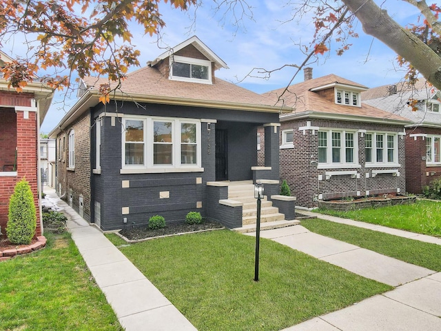 7535 S Aberdeen St, Chicago, IL 60620 - bungalow featuring a front lawn and brick siding