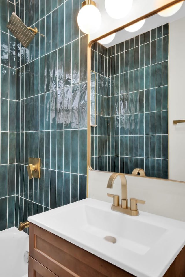 7535 S Aberdeen St, Chicago, IL 60620 - bathroom featuring tile walls, vanity, and washtub / shower combination