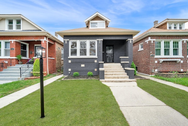 7535 S Aberdeen St, Chicago, IL 60620 - view of front facade with a front lawn and a porch