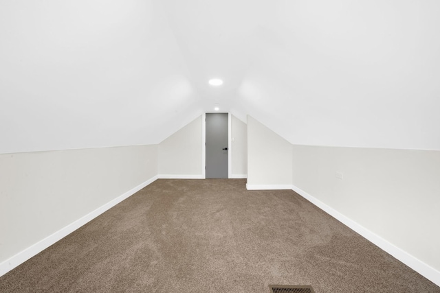 7535 S Aberdeen St, Chicago, IL 60620 - additional living space featuring vaulted ceiling, dark carpet, baseboards, and recessed lighting