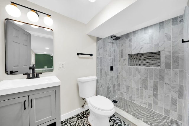 7535 S Aberdeen St, Chicago, IL 60620 - full bath featuring tiled shower, toilet, baseboards, vanity, and tile patterned flooring