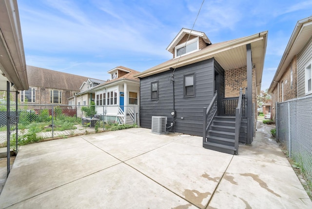 7535 S Aberdeen St, Chicago, IL 60620 - rear view of house with central AC unit and brick siding