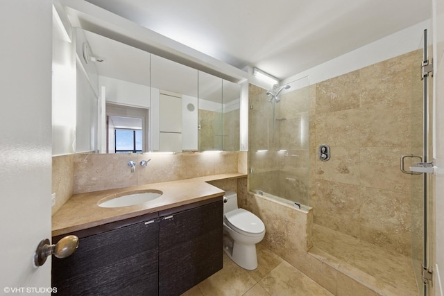 10 E Ontario St Unit 4805, Chicago, IL 60611 - full bathroom featuring a tile shower, vanity, toilet, and decorative backsplash