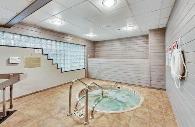 10 E Ontario St Unit 4805, Chicago, IL 60611 - interior space with a hot tub, wood walls, and a paneled ceiling