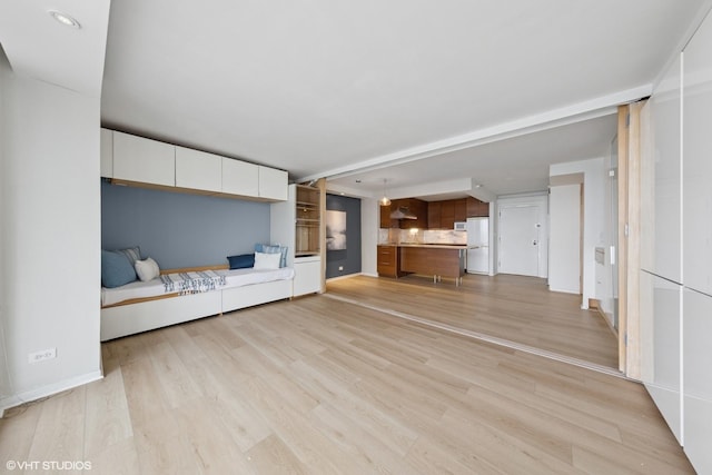 10 E Ontario St Unit 4805, Chicago, IL 60611 - unfurnished living room with light wood-style floors, baseboards, and recessed lighting