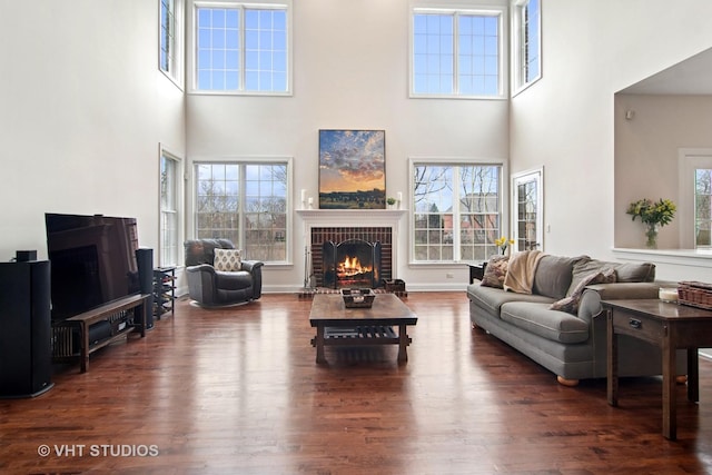 4824 Darlene Ct E, Long Grove, IL 60047 - living area featuring a brick fireplace, a towering ceiling, and wood finished floors
