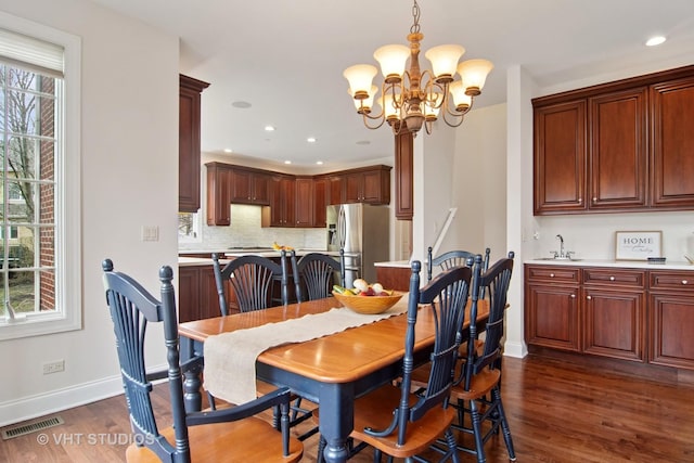 4824 Darlene Ct E, Long Grove, IL 60047 - dining space featuring baseboards, dark wood-type flooring, a chandelier, recessed lighting, and bar with sink