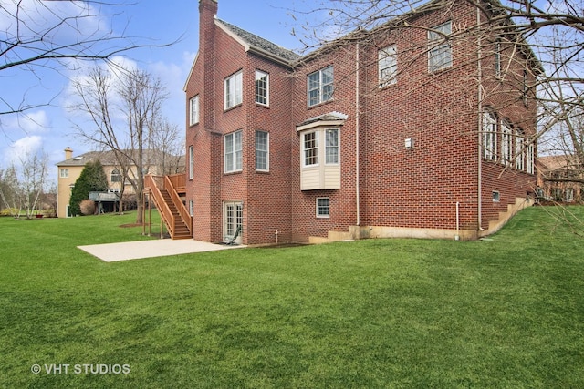 4824 Darlene Ct E, Long Grove, IL 60047 - view of property exterior with a chimney, a patio, brick siding, a yard, and stairs