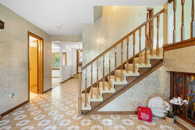 533 Lomond Dr, Mundelein, IL 60060 - stairway with baseboards, tile patterned floors, and a textured wall