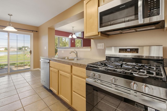 453 Lancaster Dr, Pingree Grove, IL 60140 - kitchen featuring appliances with stainless steel finishes, light brown cabinets, a sink, and hanging light fixtures