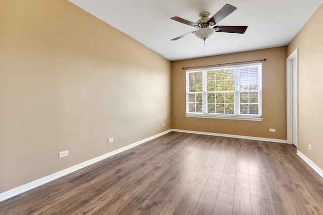 453 Lancaster Dr, Pingree Grove, IL 60140 - spare room with dark wood-style floors, ceiling fan, and baseboards