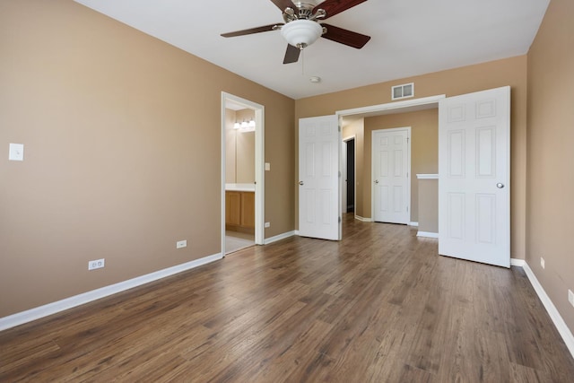 453 Lancaster Dr, Pingree Grove, IL 60140 - unfurnished bedroom with baseboards, wood finished floors, connected bathroom, and ceiling fan