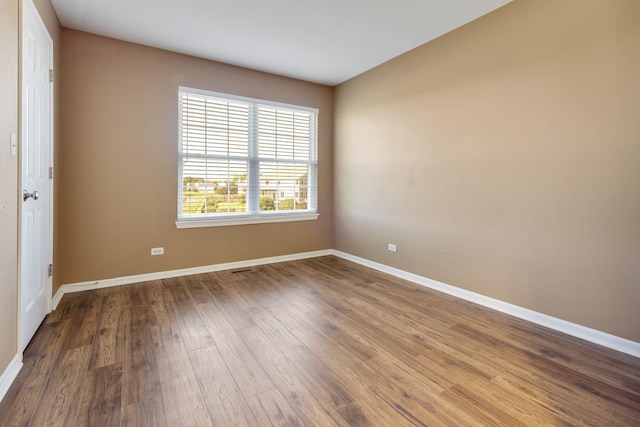 453 Lancaster Dr, Pingree Grove, IL 60140 - empty room with baseboards and wood finished floors