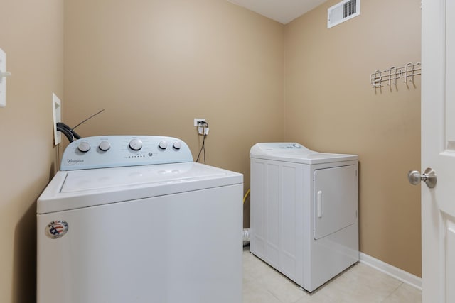 453 Lancaster Dr, Pingree Grove, IL 60140 - laundry room featuring independent washer and dryer, baseboards, and light tile patterned floors