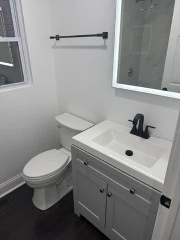 6903 S Ada St, Chicago, IL 60636 - bathroom featuring toilet, vanity, wood finished floors, and baseboards