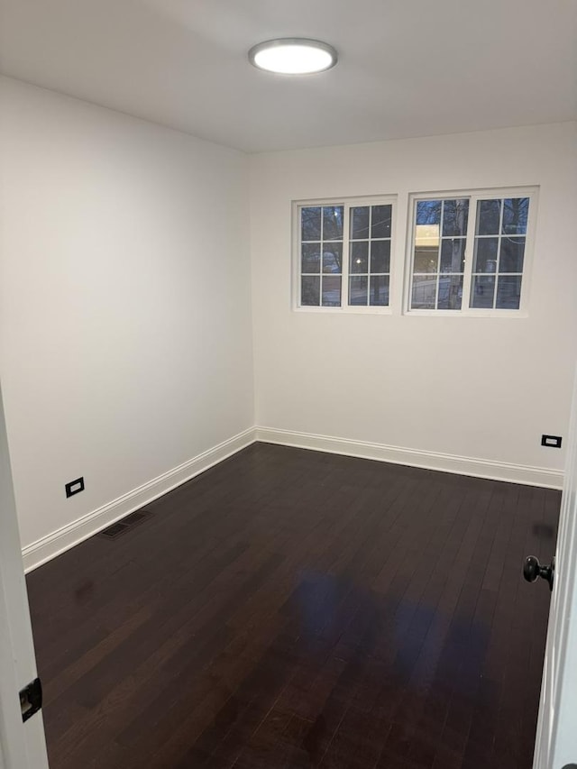 6903 S Ada St, Chicago, IL 60636 - empty room featuring baseboards and dark wood-style floors