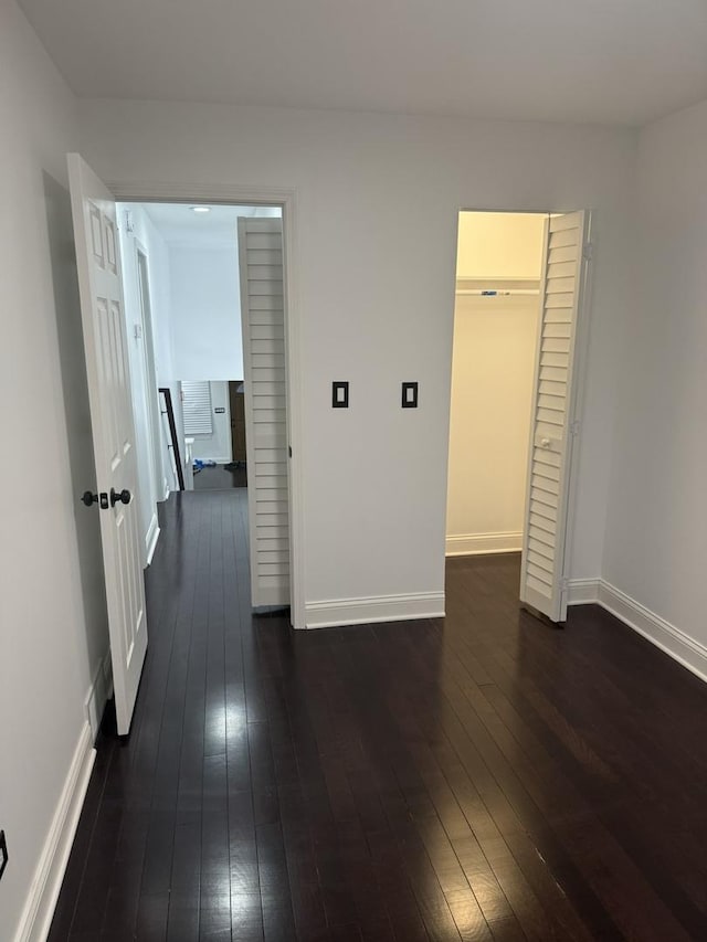 6903 S Ada St, Chicago, IL 60636 - unfurnished bedroom with dark wood finished floors, baseboards, and a closet