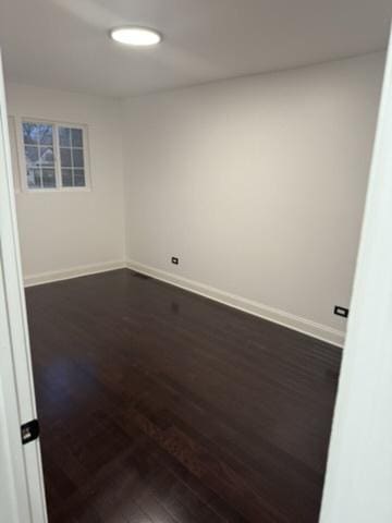 6903 S Ada St, Chicago, IL 60636 - unfurnished room featuring dark wood finished floors and baseboards